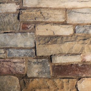 brick texture uneven buiilding multi colored stone photo