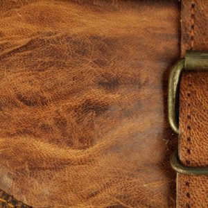 leather texture stitched bag brass buckle stock photo