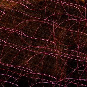light texture swirl red firework pattern glowing streaks purple