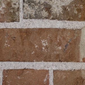 rough brick texture masonry dark brown close up photo
