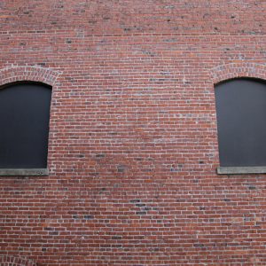 Brick wall photo with black window frames
