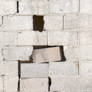 Brick white wall damaged from war