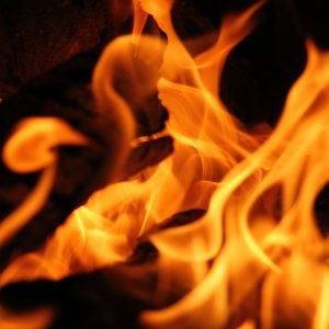 Fire burning near end of wood