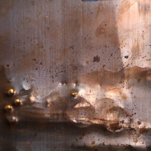 Metal Punctured Wall Photo