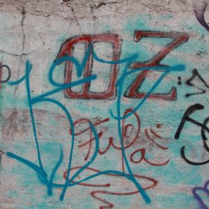 Spray Paint Writing On Concrete Wall With Colors
