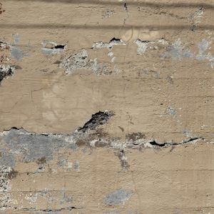 Stone broken concrete wall with holes