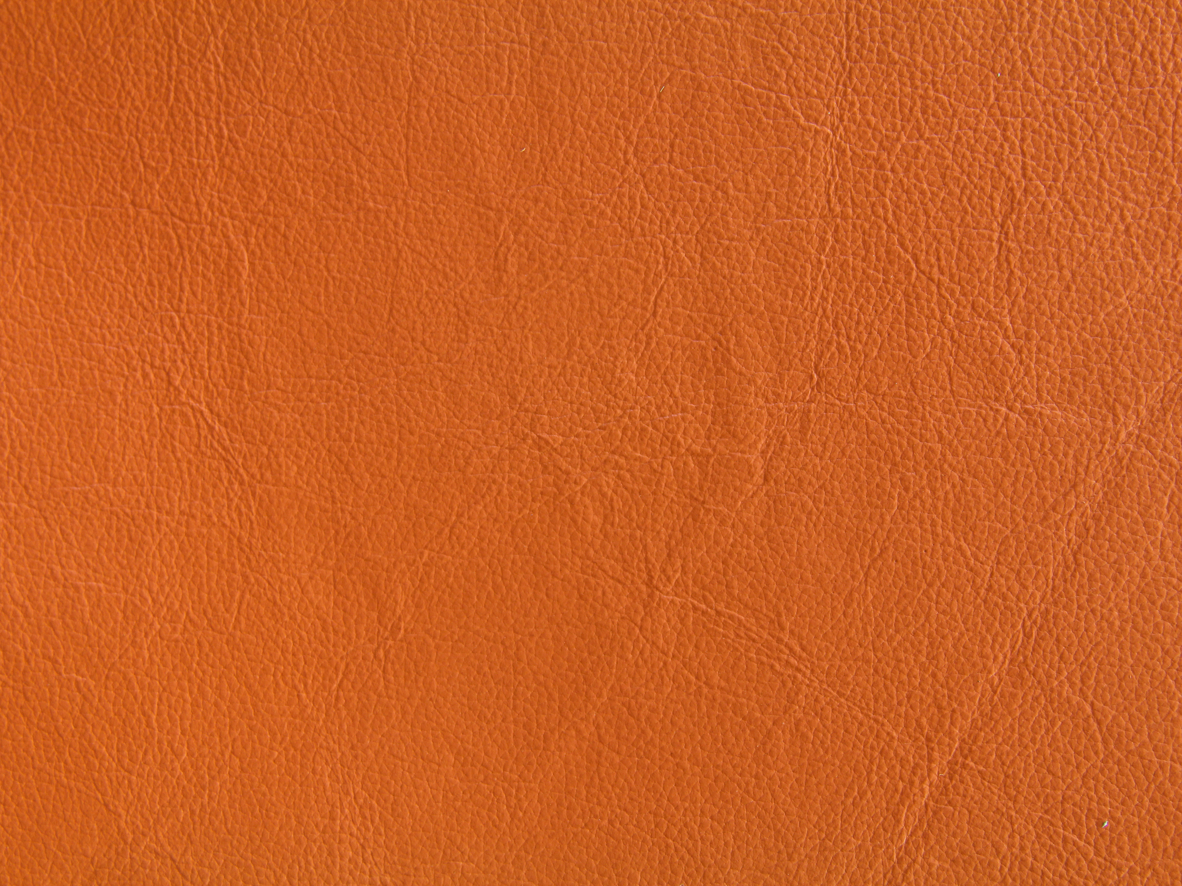Orange-leather-texture-bright-fabric-wallpaper-design-stock-photo