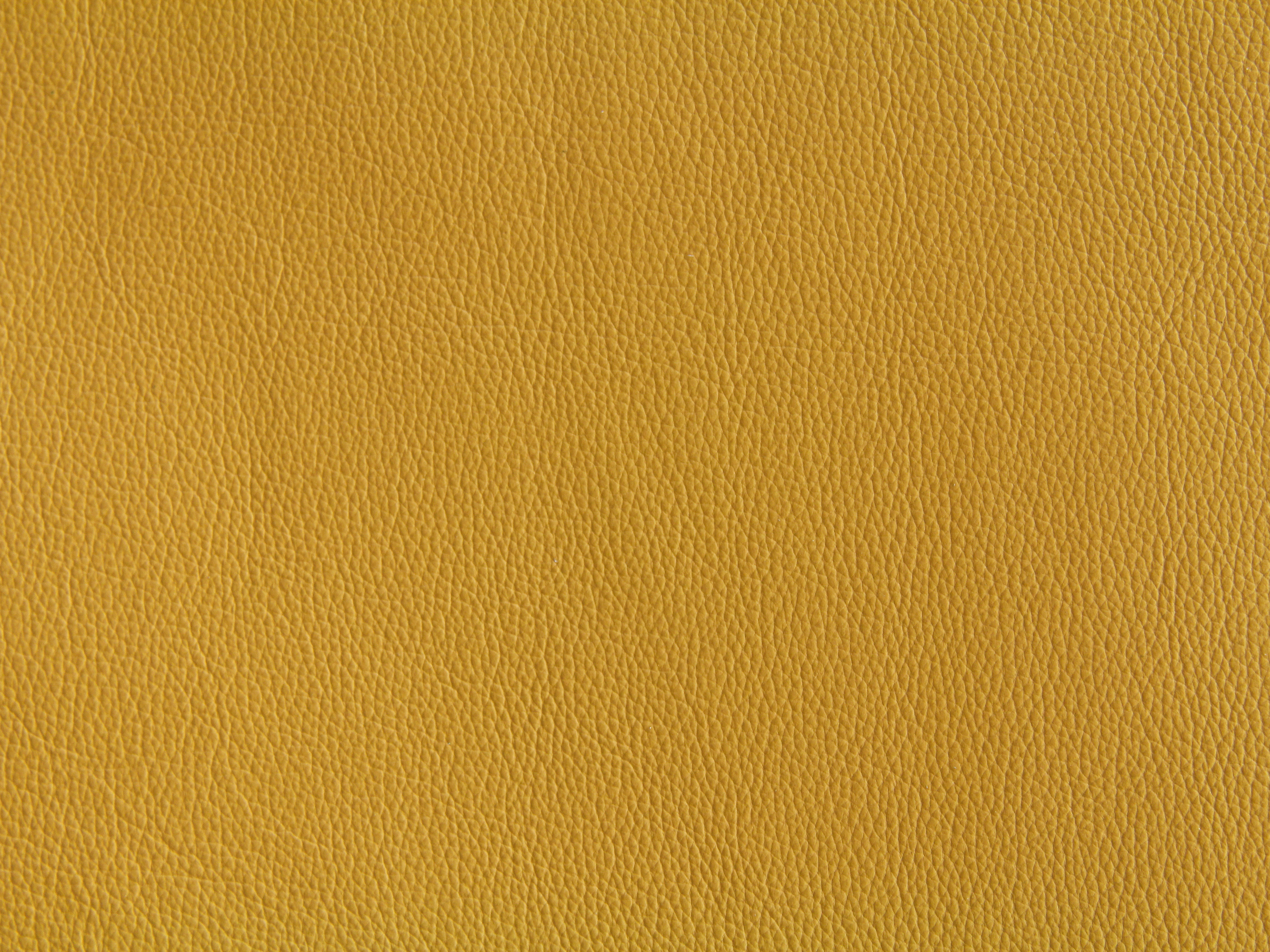 Yellow-leather-texture-wallpaper-fabric-material-design-bright-stock-photo