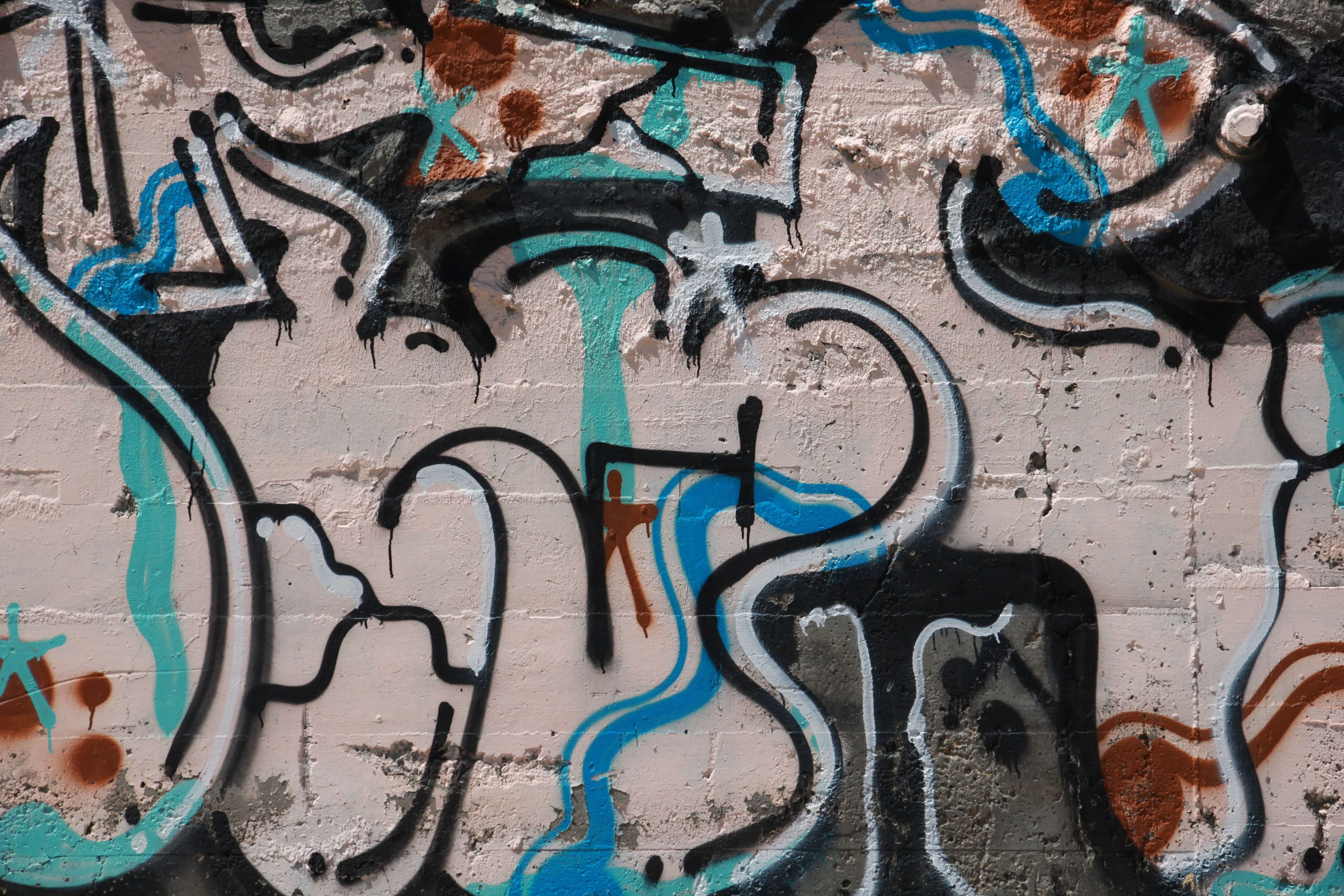 Assorted Spray Painted Colors On Large Wall Graffiti