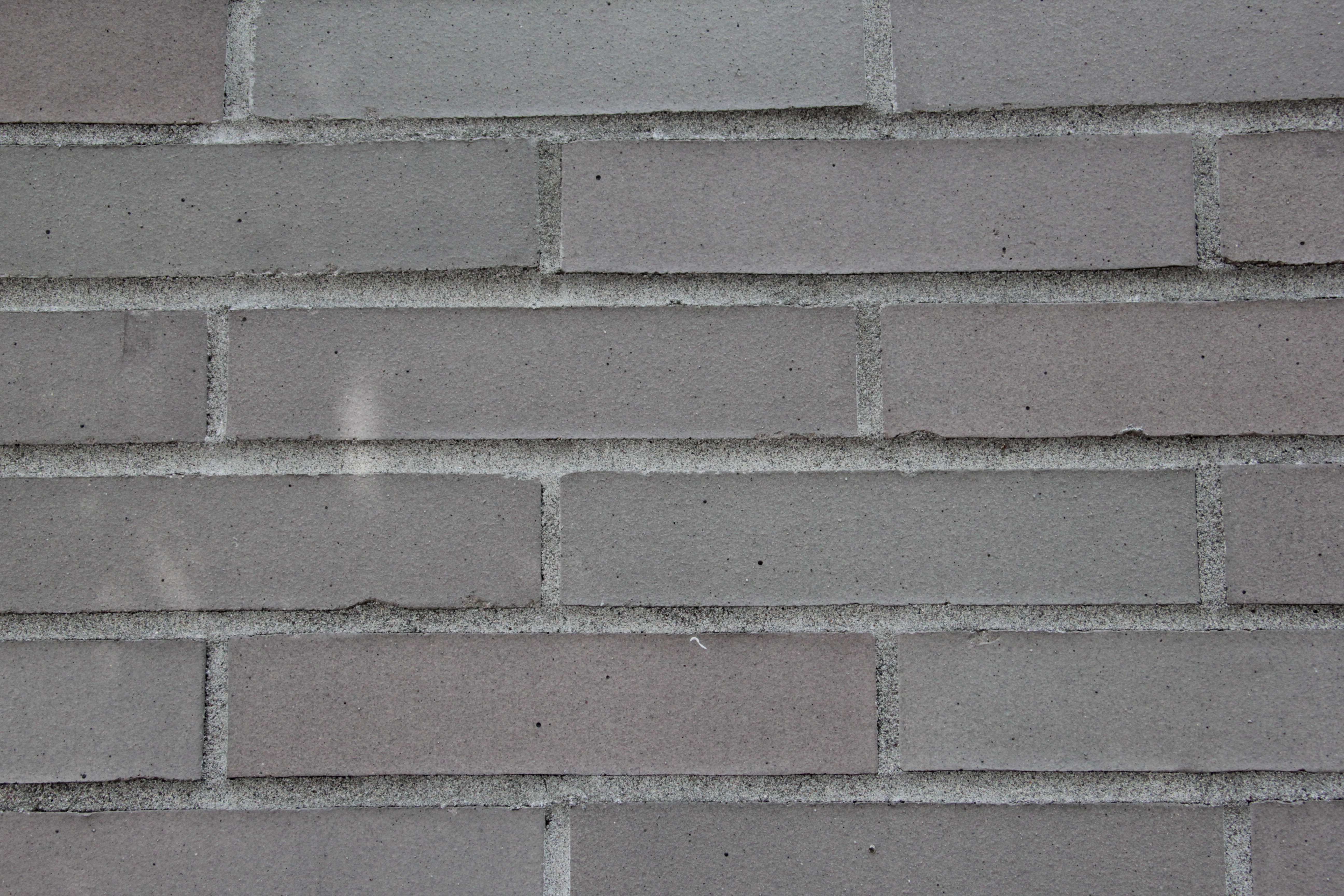 Brick Gray Wall With Different Color Grades