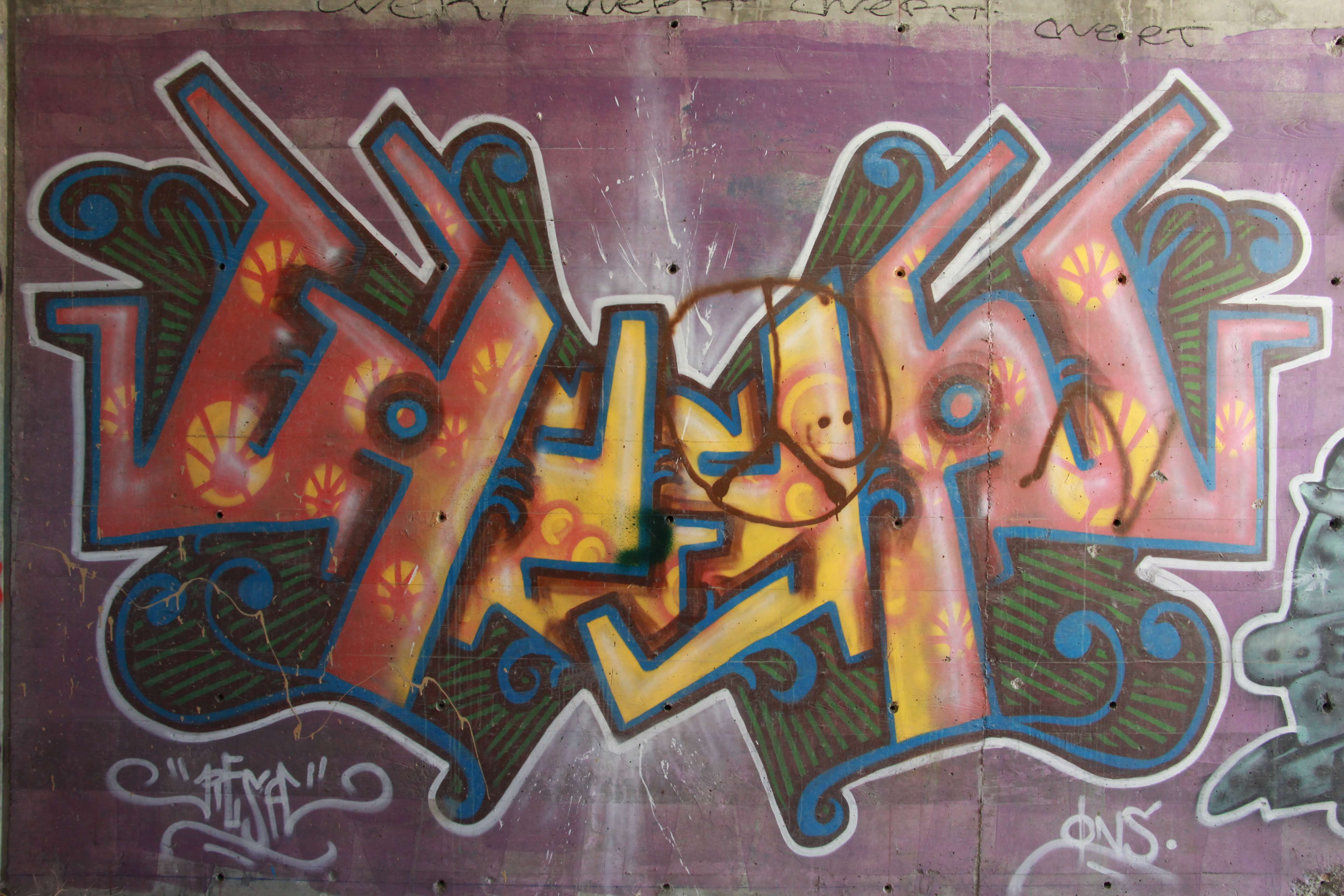 Cool Logo Spray Paint Graffiti On Concrete Wall