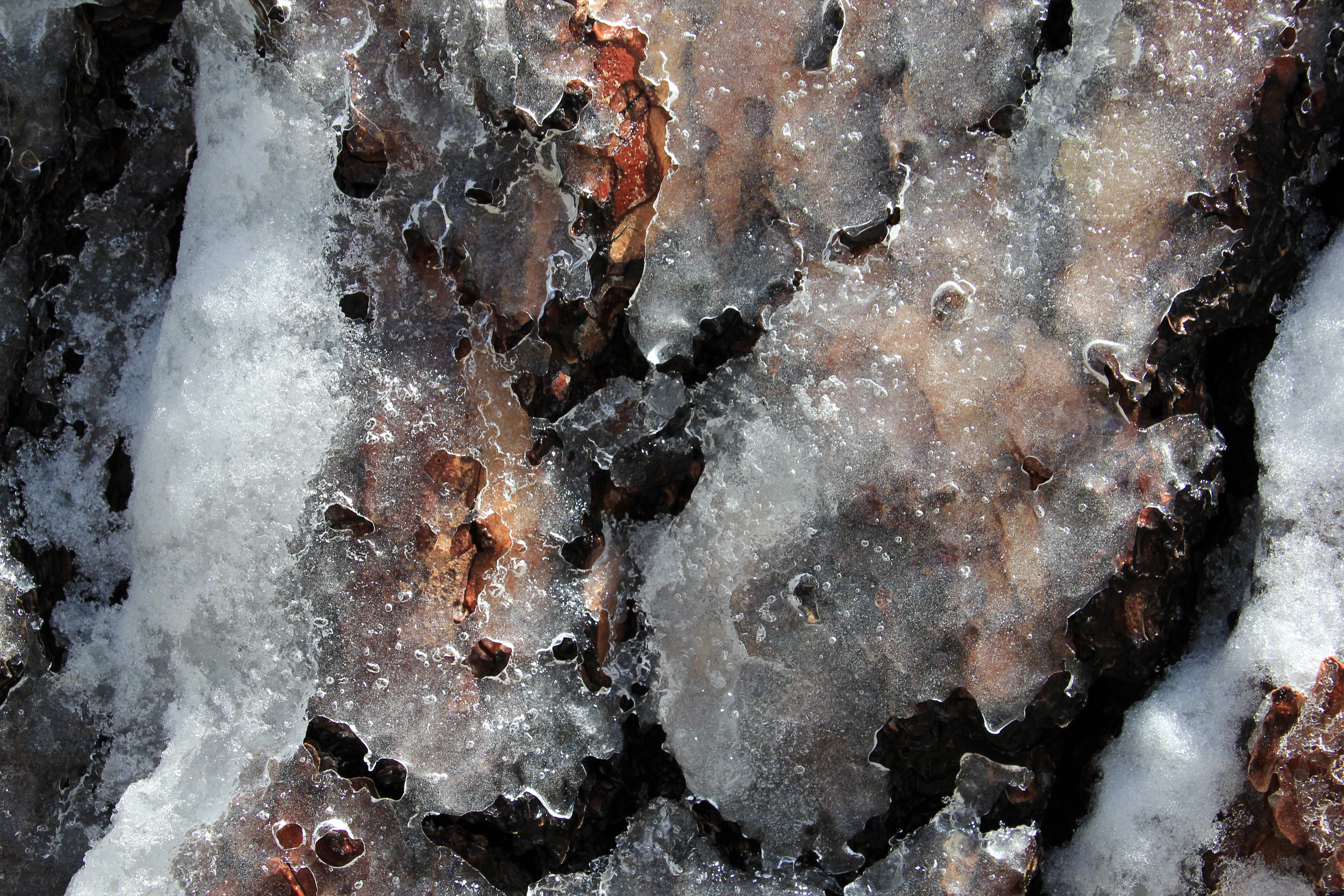 Ground Icicles On Top Of Rock Outside