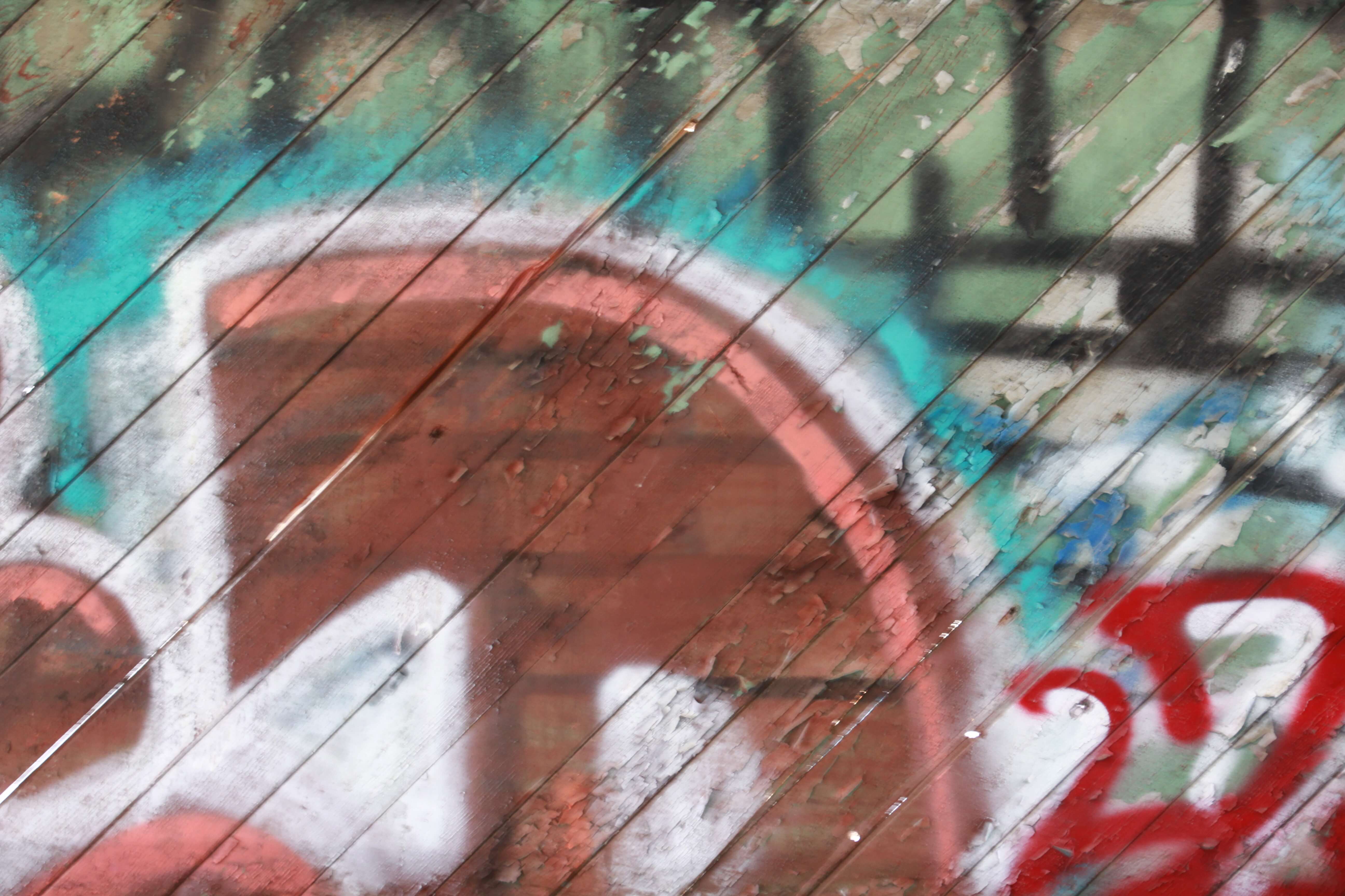 Red Blue Graffiti On Wood Planks Floor