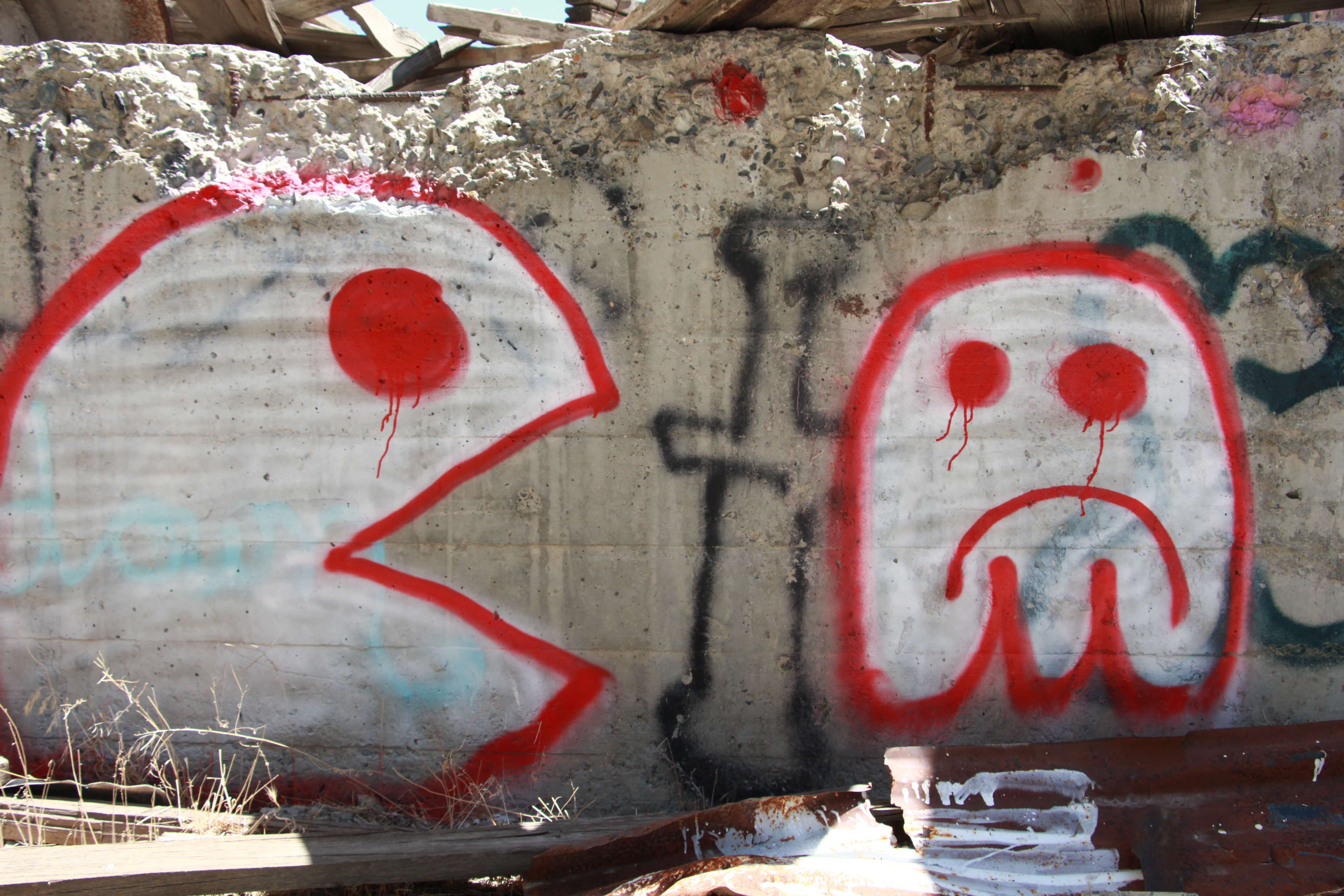 Red White Pac Man Spray Paint Graffiti On Wall