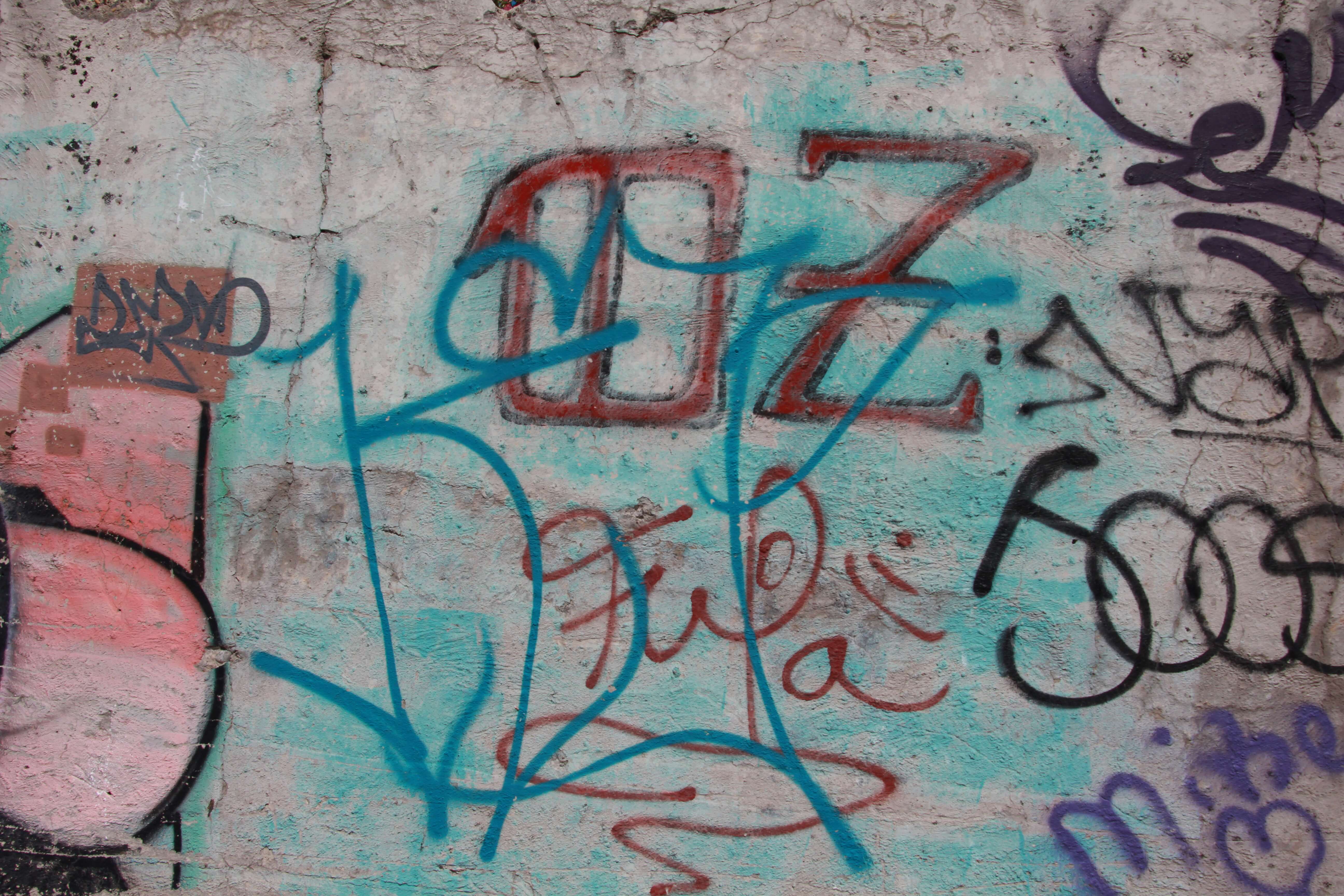 Spray Paint Writing On Concrete Wall With Colors