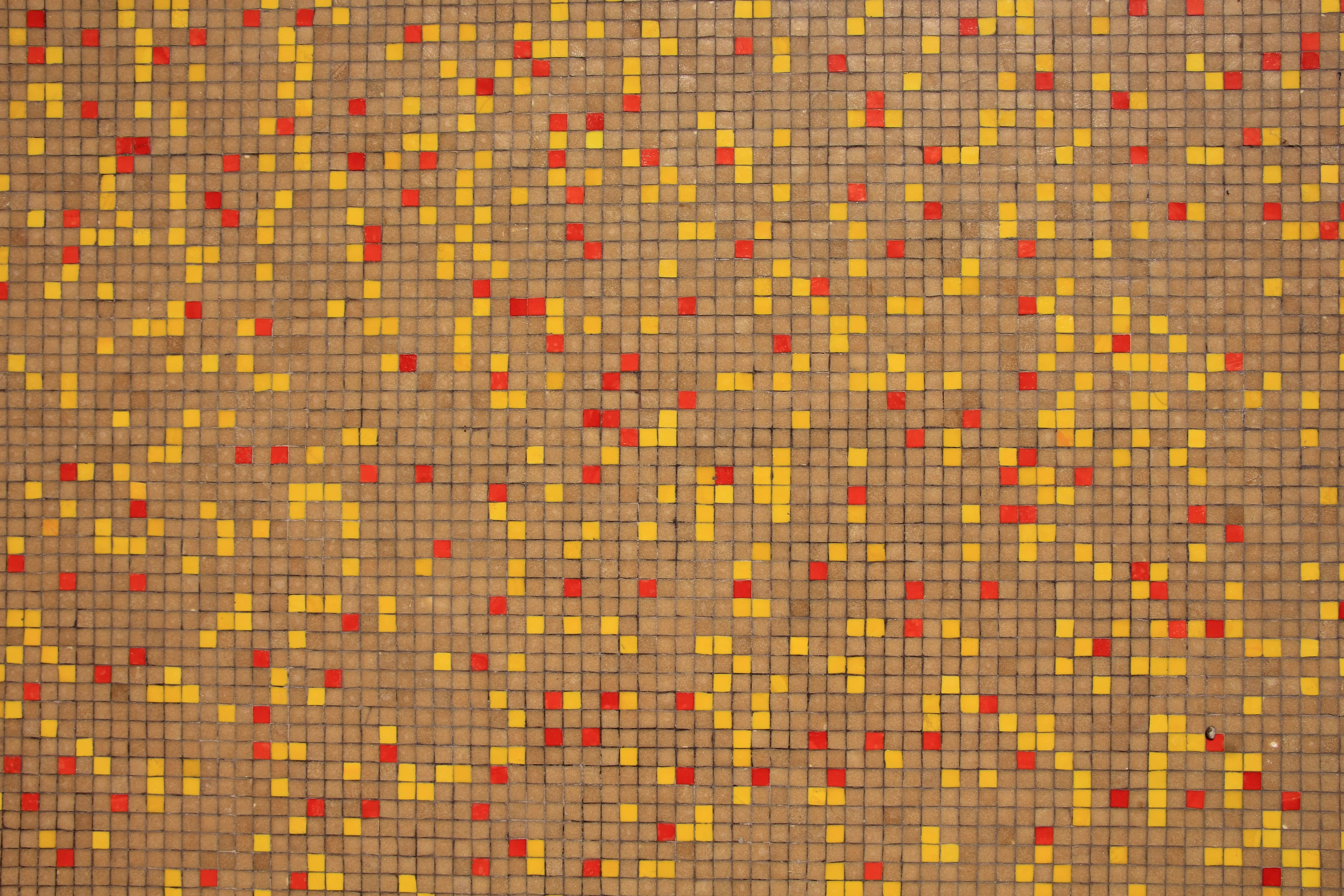 Stone Wall With Yellow And Red Drops